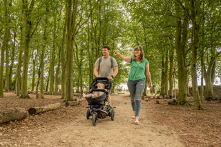 A family walking through woodland